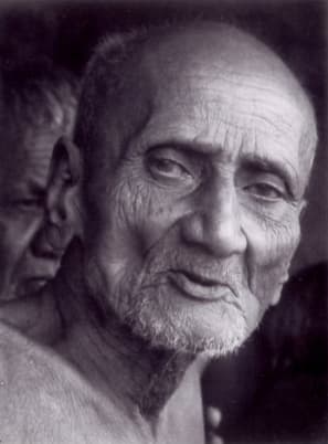 Black-and-white close-up of Acharya Shanti Sagar Ji Maharaj in old age.